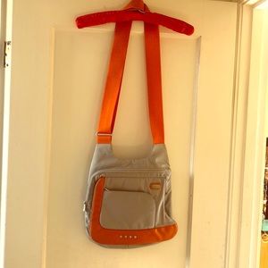 Tumi crossbody tech bag